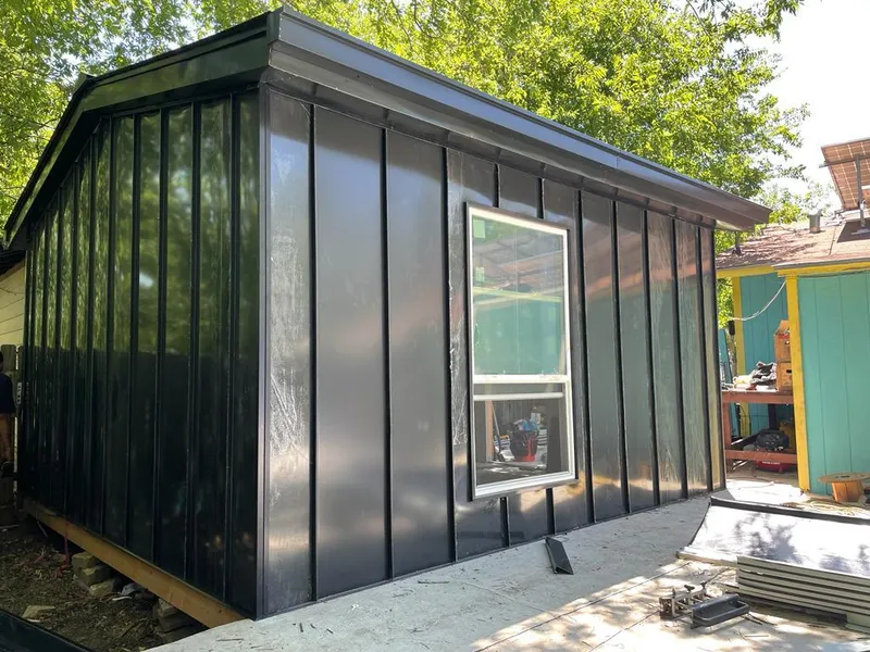 Black standing seam metal wall panels for Roof Inspection in Camp Swift