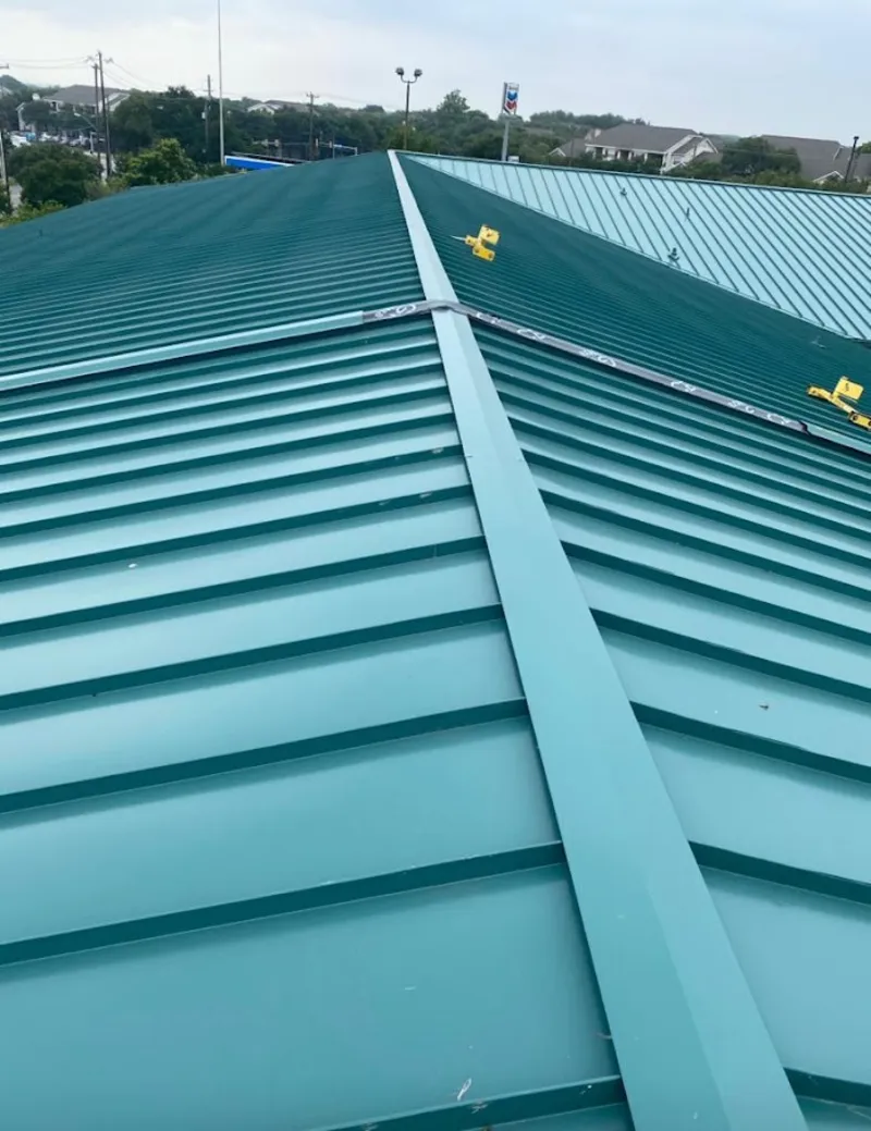 Green commercial metal roof ridge and valley for Metal Roof Repair in Camp Swift